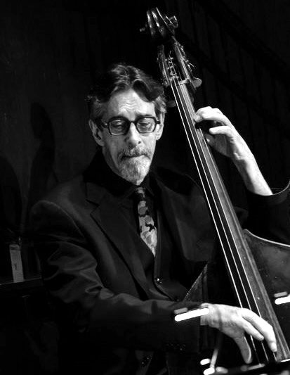 Ritt on upright bass under stage light