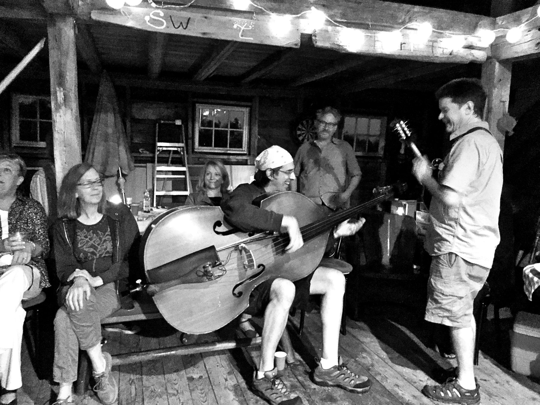 Ritt playing upright bass at a porch jam with friends